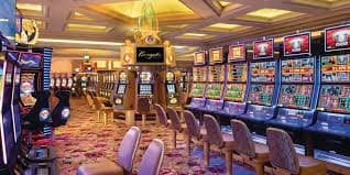 celoslot Money Train live casino tables on mobile phone screen showing blackjack dealer and roulette wheel